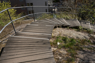 Wooden stairs built and fitted to a cliffside.