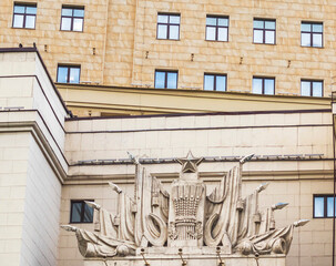 Facade of the building with soviet era emblems. History