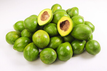 bunch of avocado fruit isolated on white, top angle view