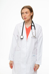 Beautiful girl doctor professional in work clothes on white background 