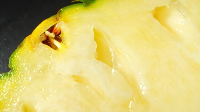 Explore the tantalizing world of Pineapple slices up close with a mesmerizing macro video shot through a probe lens. Witness the intricate textures, vibrant colors, and juiciness in 4K detail.
