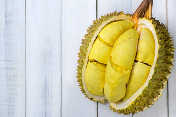 Durian fruit. Ripe monthong durian on white wood background, king of fruit from Thailand on summer