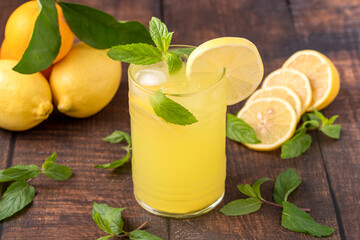 Iced lemonade in glass glass on wooden table