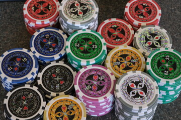 Poker chips piled up on table