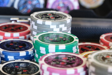 Poker chips piled up on table