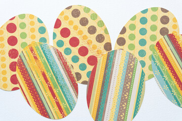 decorative polka dot and striped paper ovals on white