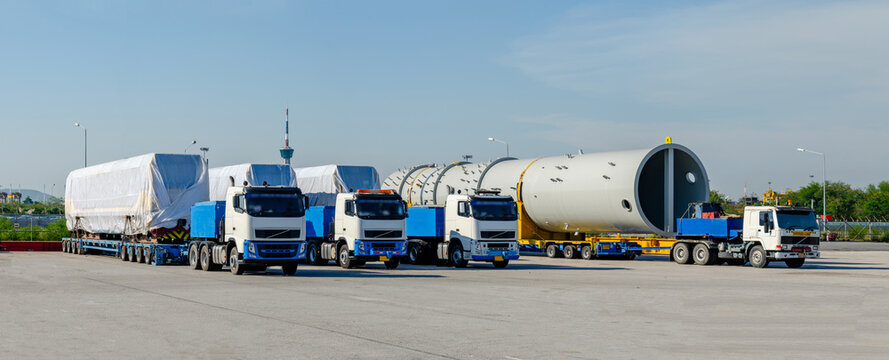 Transport of Oversize Heavy cargo trailera new diesel-electric locomotive on a multi-axle hydraulic modular truck trailer Loading a port area