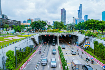 Crowded traffic exits Thu Thiem tunnel on morning. This is an economic transport project across the...