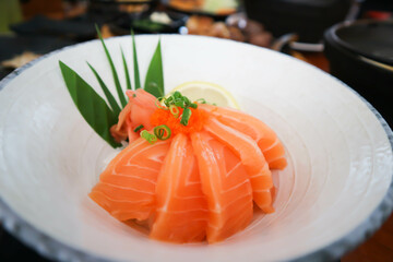 raw salmon, sashimi or sliced salmon or salmon sashimi