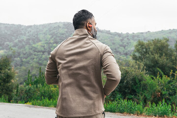 Man with distracted along a forest road