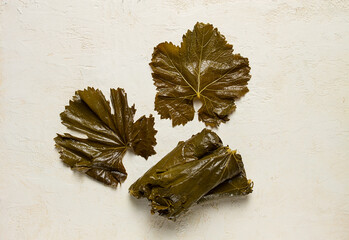 preserved grape leaves for dolma , top view, on a white table,