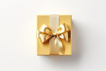 Obraz na płótnie Canvas Yellow gift box with golden bow