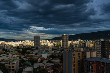 Dramatic sky on the sunset over Tbilisi's downtown
