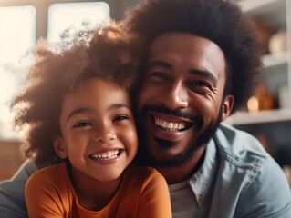 Portrait of african american father and daughter smiling happily. Father's day