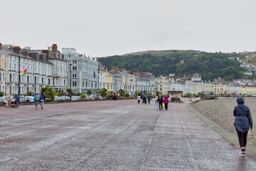 Naklejka premium people walking in the city in Llandudno