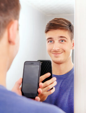 Happy Young Man with a Phone