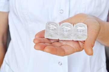 Contact Lens Care.Medical worker holding a blister with contact lenses.Eye Care And Vision Concept.