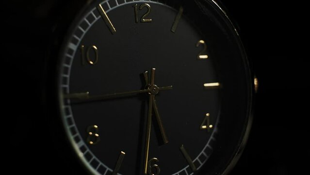 Mechanical watch close-up. Accelerated clock video. arrows move quickly. dark background. Time . The concept of quickly passing time.
