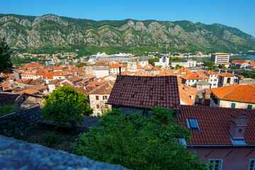 Fototapeta na wymiar view of the old town of Kotor in Montenegro, tiled roofs and cozy courtyards, medieval architecture, travel