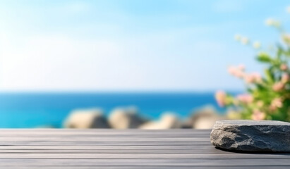 Empty stone podium on the wooden table with sea view and flower blurred background. For product display