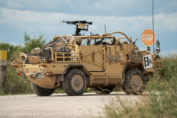 Close-up of a British army Supacat Jackal at a road crossing, Wiltshire UK