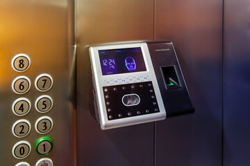 The fingerprint access control terminal with face recognition function installed in the elevator of...