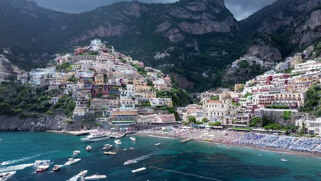 Positano resort, Italy, famous old italian resort and Tyrrenian sea, Background Beach Water House Summer Nature Italy Landscape, Beautiful flight over Amalfi, Colorful dark clouds in sunrise sunset 