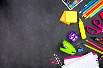 School supplies side border. Top down view on a dark blackboard background. Copy space. Back to...
