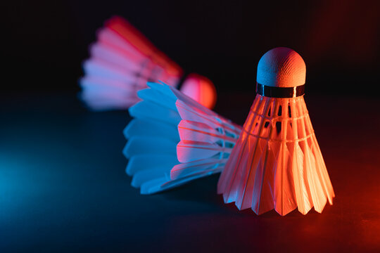 badminton shuttlecock on court in vibrant lighting decoration for competitive high performance indoors rackets sports game tournament match equipments for advertising graphics image