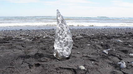 block of Ice shaped like a diamond at diamond beach in Iceland