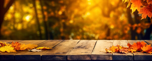 Naklejka na ściany i meble Autumn maple leaves on wooden table top. Falling leaves natural background. Sunny autumn day with beautiful orange fall foliage in the park. wide panoramic background, digital ai