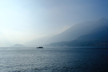 Peaceful blue landscape with Como Lake and alps mountains  seen from Bellagio, Lombardy, Italy