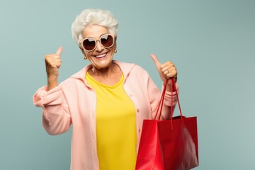 Fictional old lady with shopping bags and sunglasses, smiling. Isolated on a colored background.  Generative AI.
