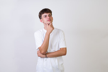 young caucasian man over isolated white background smiling cheerfully pointing index finger away