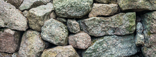 Wall of rough stones background