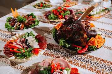 Fototapeta na wymiar Cossack table in the best restaurants. Festive table at the wedding. National Ukrainian cuisine. Fat, sausages, alcohol. Catering.