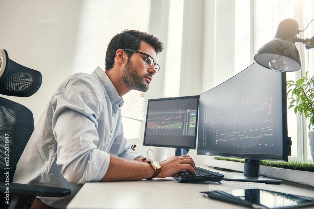Aufkleber confident businessman. young bearded trader in formal wear is analyzing trading charts on computer s