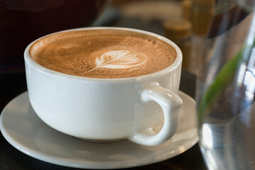 Cup of cappuccino in a restaurant.
