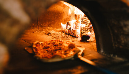 Pizza cooking in an authentic Pizza oven