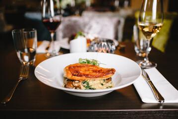 Served table in restaurant with meal in focus