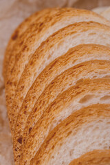 Sliced white bread with brown crust closeup. Macro shot.