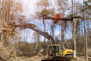 Drones are being used by environmental services to monitor uprooting trees in construction site