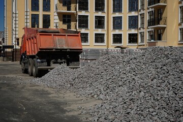 Fototapeta na wymiar Crushed stone mounds.Grey crushed stones in close up,Versatile building material for horticulture,landscape gardening or road construction,Material for railroad construction.