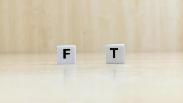 Tiles that make up the word fat are modified to make up the word fit