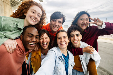 Happy young teen student college friends group having fun together taking selfie portrait outside
