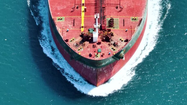 Aerial view container ship sailing on sea to transport cargo at port