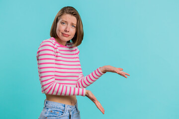 Woman raising hands asking what why reason of failure, demonstrating disbelief irritation by...