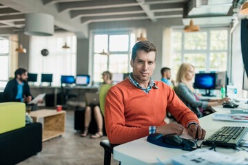 Portrait of a young startup company male office worker