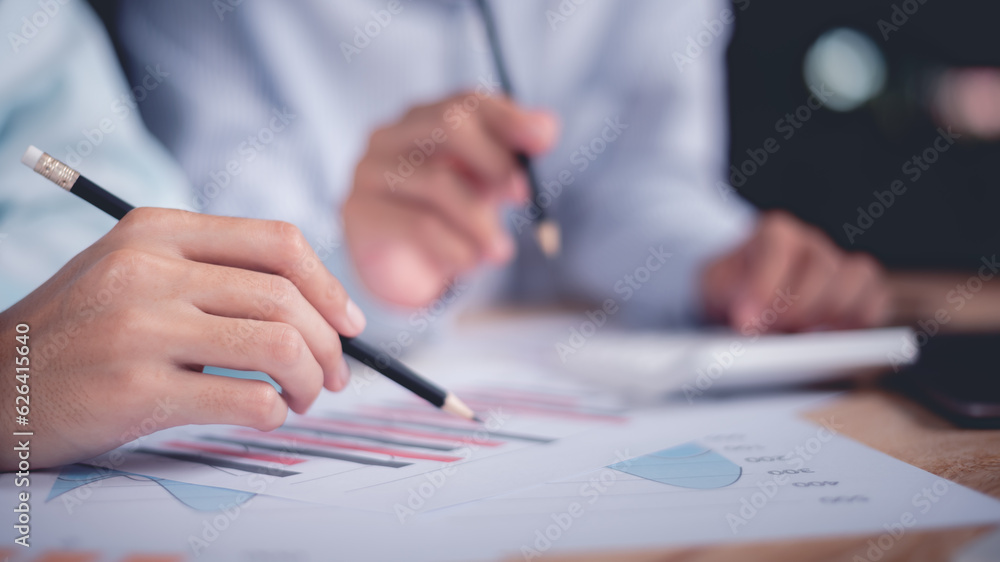 Leinwandbilder statistical analyst reading graph report and business statistics charts ,analysis and improvement of