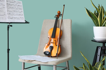 Chair with violin and note stand in room - obrazy, fototapety, plakaty